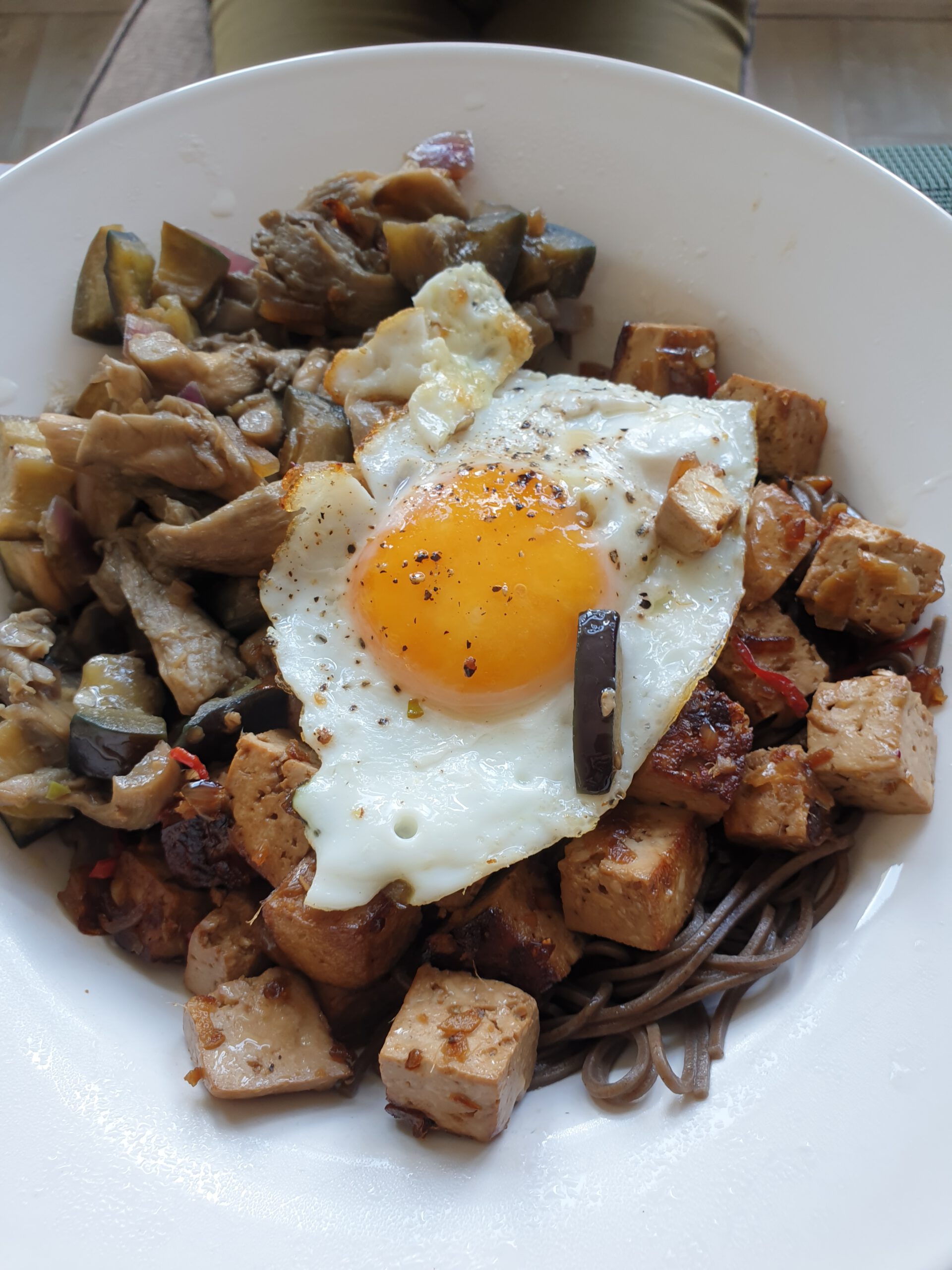 Azian wok dish with fried egg